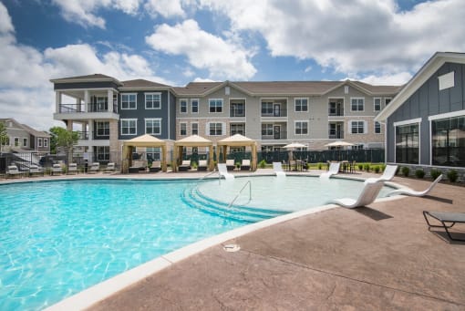 Swimming Pool With Lounge Chairs at Watermark at Steele Crossing, Arkansas