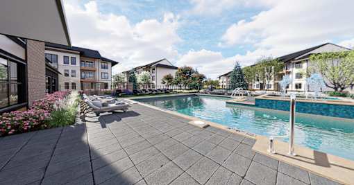 A swimming pool surrounded by apartment buildings at The Logan Luxury Apartments, Nampa