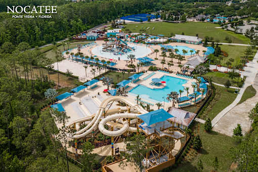 Aerial view of community waterpark and resort pool at Velara Luxury Apartments, Florida, 32081