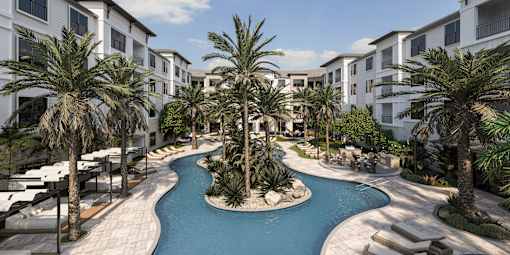 A pool surrounded by palm trees and white buildings at The Stadler Luxury Apartments, Bradenton, Florida