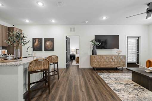 A modern kitchen with wooden floors and furniture. at Terrassa Luxury Apartments, St. Augustine