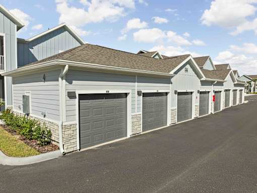 A row of houses with garages on the side. at Junction Apartments in Rockledge, FL