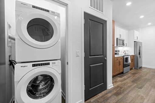A white Whirlpool washing machine and dryer in a modern laundry room. at Junction Apartments in Rockledge, FL