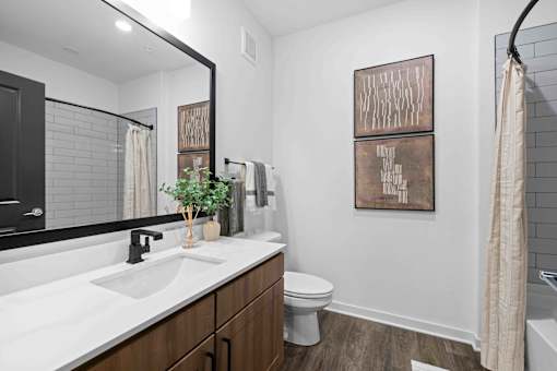 A bathroom with a white sink and a toilet. at Junction Apartments in Rockledge, FL