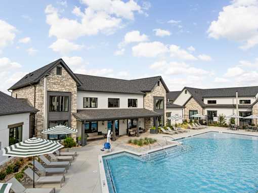 Pool With Shaded Lounge Chairs at The Levi Luxury Apartments, Georgia