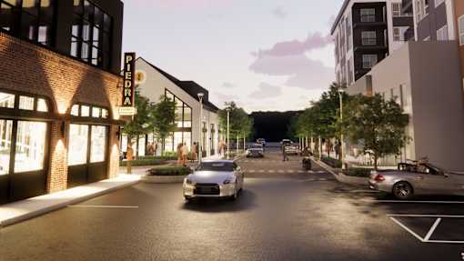 A street view with cars and buildings on both sides at The Union Flats at Fishers District, Fishers