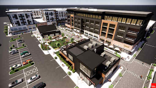 A rendering of a modern building complex with a parking lot in front at The Union Flats at Fishers District, Fishers