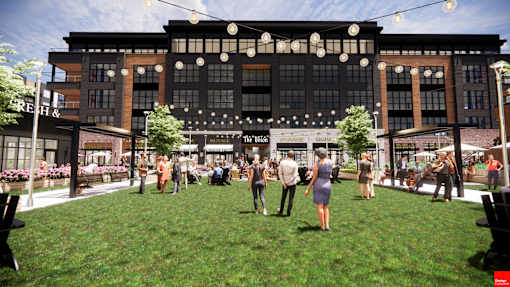 A group of people are standing in front of a building with a sign at The Union Flats at Fishers District, Fishers, IN 46037