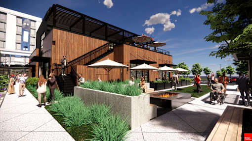 A modern building with a wooden exterior and people walking around at The Union Flats at Fishers District, Fishers, Indiana