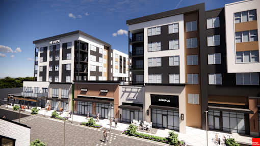 A modern apartment complex with a mix of residential and commercial spaces at The Union Flats at Fishers District, Fishers, IN