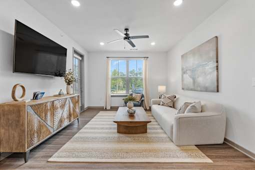 Living Room With TV at The Quinn Luxury Apartments, Pensacola, FL, 32526