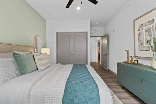 Bedroom With Ceiling Fan at The Quinn Luxury Apartments, Florida