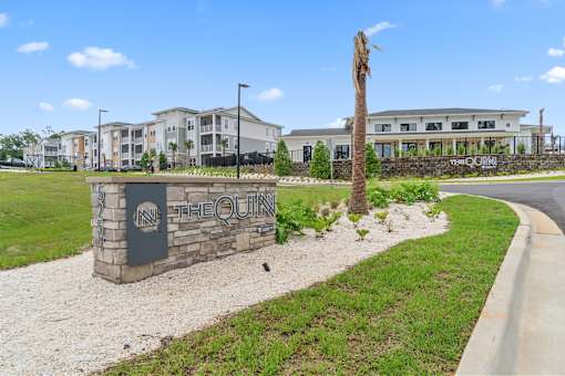 Welcoming Property Signage at The Quinn Luxury Apartments, Pensacola, Florida