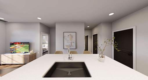 A modern bathroom with a large sink and a television at Stack at Wheat Ridge Apartments, Colorado