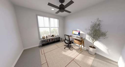 A room with a ceiling fan, a desk with a computer, and a window with blinds at Stack at Wheat Ridge Apartments, Wheat Ridge, 80033