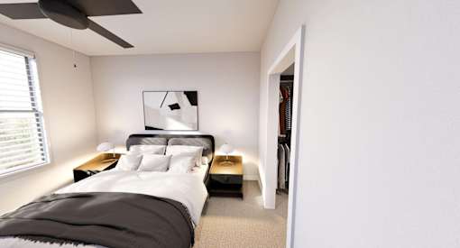 A bedroom with a bed, nightstands, and a ceiling fan at Stack at Wheat Ridge Apartments, Colorado, 80033