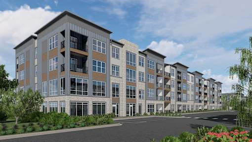 A modern apartment building with a parking lot in front. at Stack at Wheat Ridge Apartments, Apartments, Wheat Ridge, CO