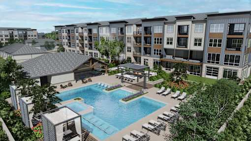 A large swimming pool surrounded by lounge chairs and umbrellas is the centerpiece of a resort-style outdoor area. at Stack at Wheat Ridge Apartments, Apartments, Wheat Ridge, CO