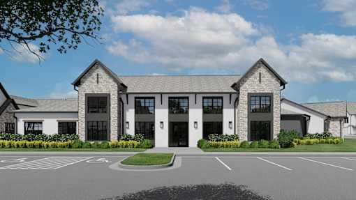 A large, modern building with a parking lot in front at The Levi Luxury Apartments, McDonough, 30253