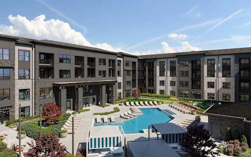 A large building with a pool in front.