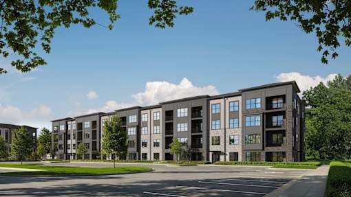A large apartment complex with multiple buildings and balconies.