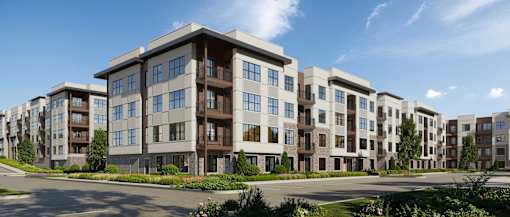 A large, modern apartment complex with multiple buildings and balconies.