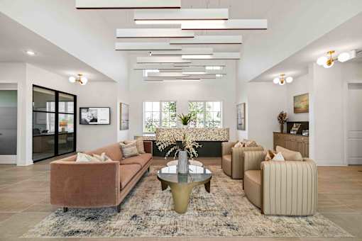 A living room with a brown sofa, a coffee table, and a rug at Verity Luxury Apartments, Vero Beach, FL 32960