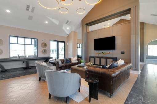 a living room with couches and chairs  at Upland Flats, Colorado Springs, Colorado