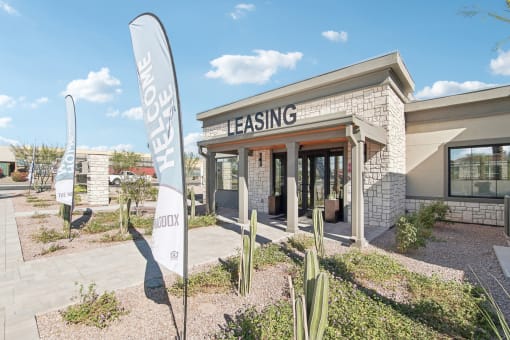 a rendering of a building with cactus in front of it at The Maddox Luxury Apartment Homes, Arizona  