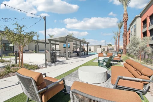 a lounge area with couches and chairs and tables at the resort at The Maddox Luxury Apartment Homes, Buckeye, AZ  