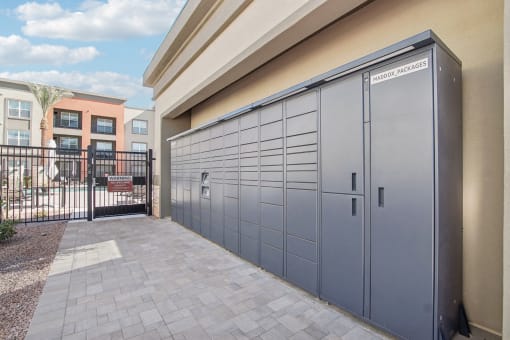 the garage of a building with closed doors at The Maddox Luxury Apartment Homes, Arizona, 85326 
