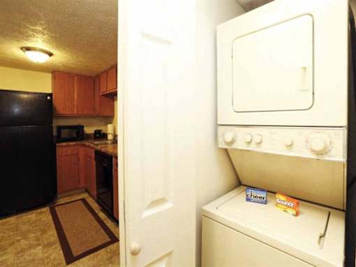 A white oven with a box of cheer and a box of bounty on it.