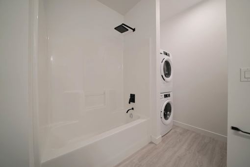 Modern Bathroom with In-suite Laundry at 703 St. Anne's Road Apartments, Winnipeg, MB