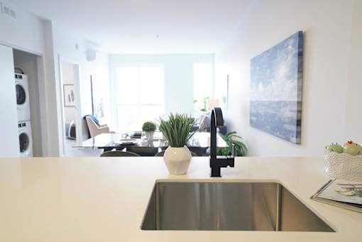 Modern Kitchen With Dining Area at 703 St. Anne's Road Apartments, Winnipeg,MB