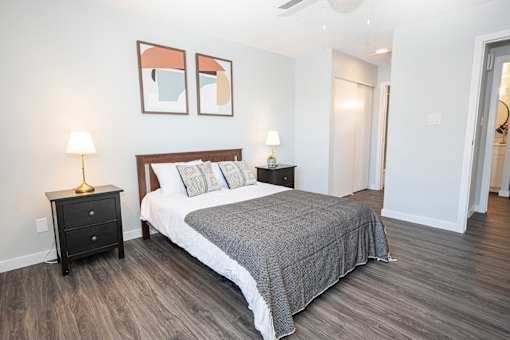 a bedroom with a bed and two night stands