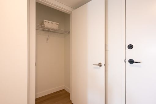 A white door with a black handle is closed.
