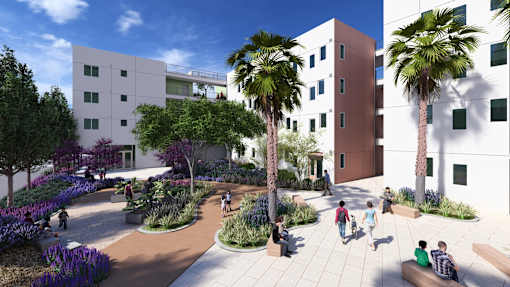 A modern courtyard with people sitting and walking around.