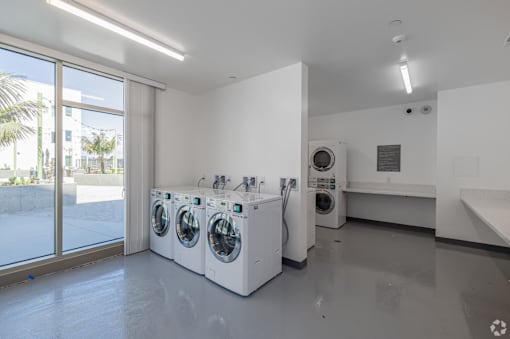 A laundry room with a washer and dryer in it.