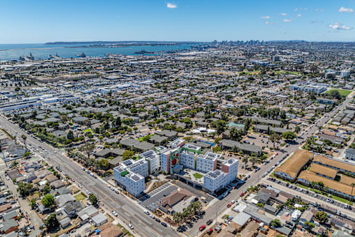 A cityscape with a mix of residential and commercial buildings.