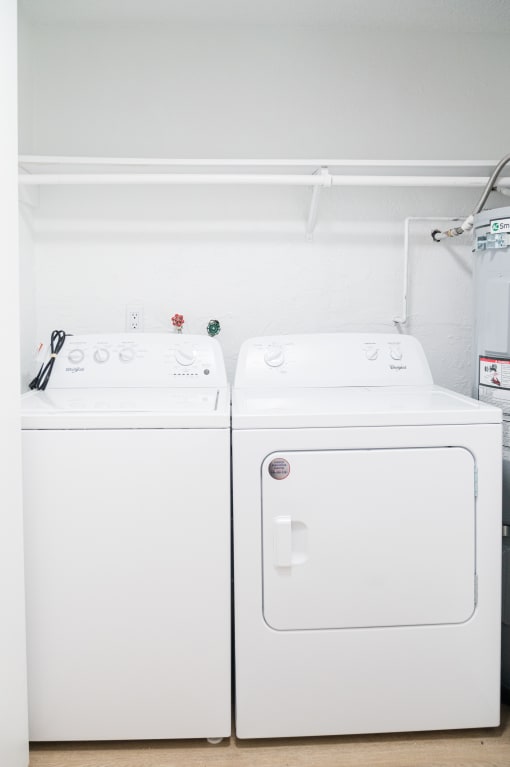 a small laundry room with a washer and dryer at Chalet, Springfield