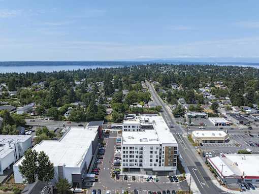 A view of a town with a large building in the center.