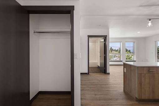 a view from the kitchen into the living room and the hallway to the bedrooms at Elevation16 Apartments, Seattle, 98146