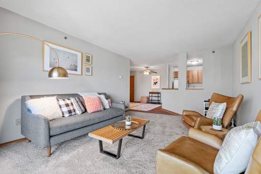 a living room with a couch and a chair and a table