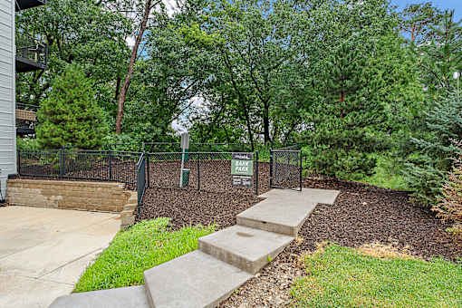 A park area with a sign and steps.