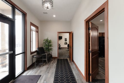 a view of the lobby from the front door of a house