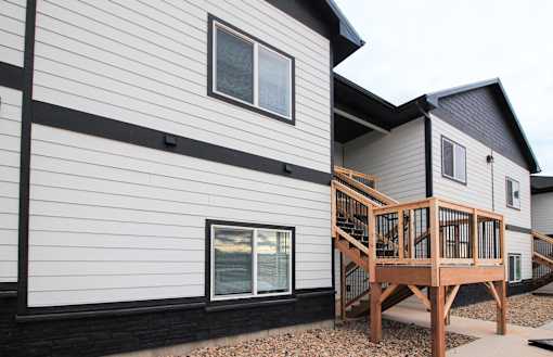 A modern house with a wooden deck.