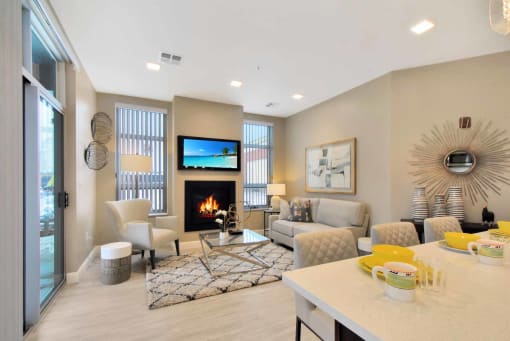 a living room with a fireplace and a table