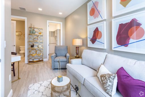 a living room with a couch and a chair