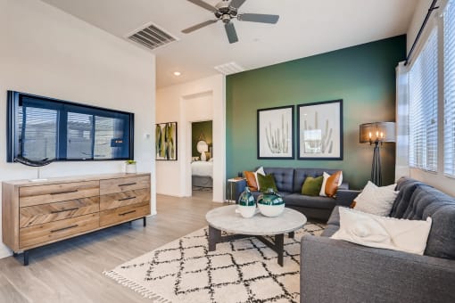 Living Room With Television at Avilla Centerra Crossings, Goodyear, AZ, 85338