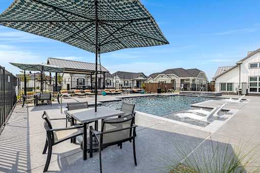 Resort-style pool and lounging at Avilla Oakridge in Forney, TX.